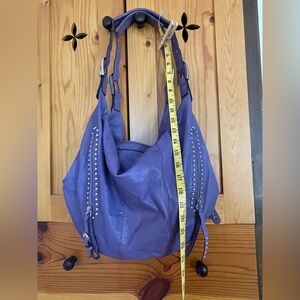 B Makowsky purple leather studded hobo purse.